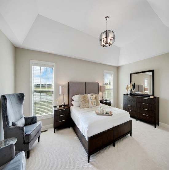 dark furniture in spacious master bedroom